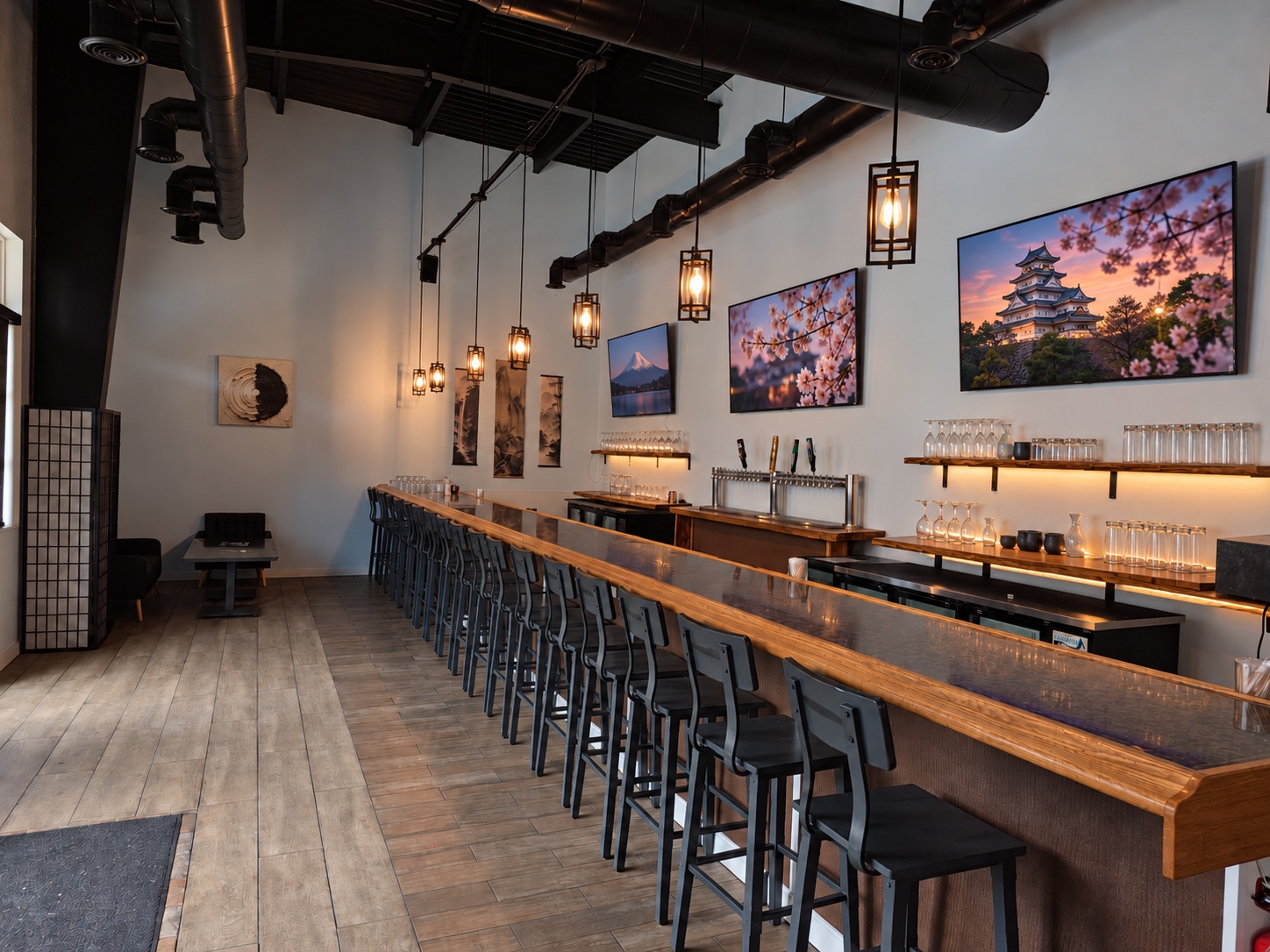The bar at Osaka Express in Senoia, Georgia, with ten draft taps, caged Edison pendants and TVs above a long oak counter